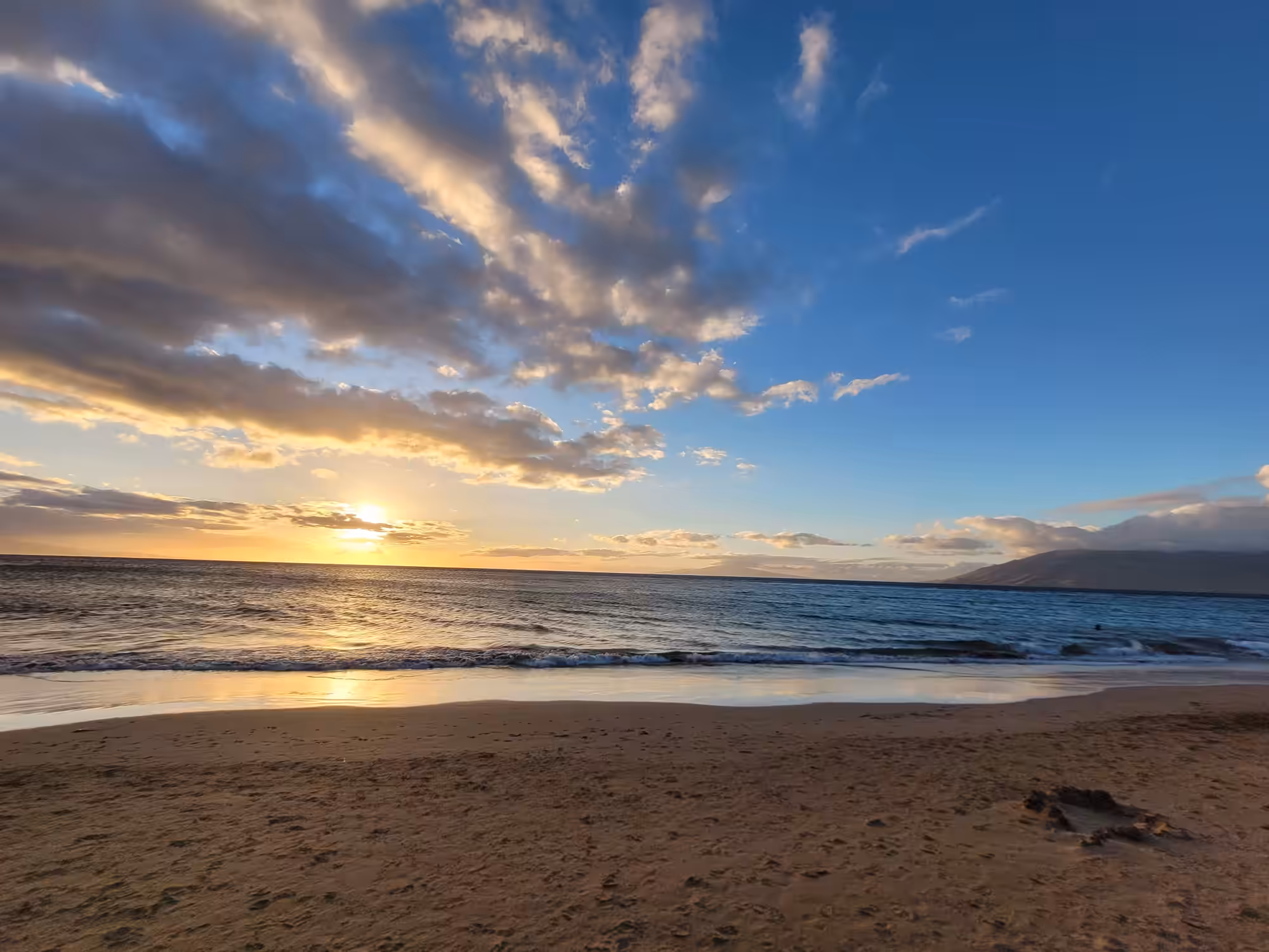 Kihei Kai Nani #166 lanai at dusk surrounded by tropical gardens