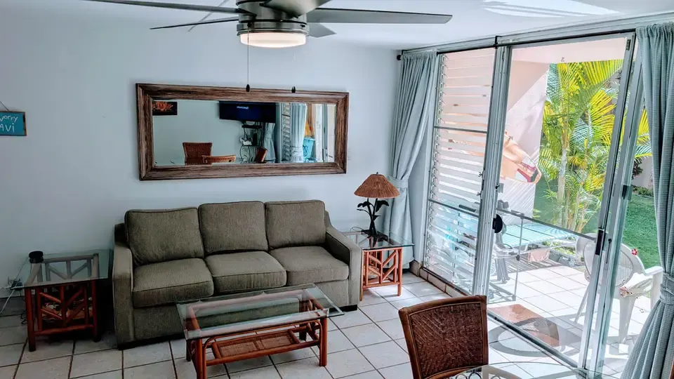 Living room sofa beside the sliding lanai door