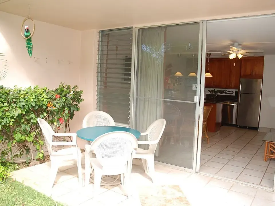 Patio dining table outside the open lanai door